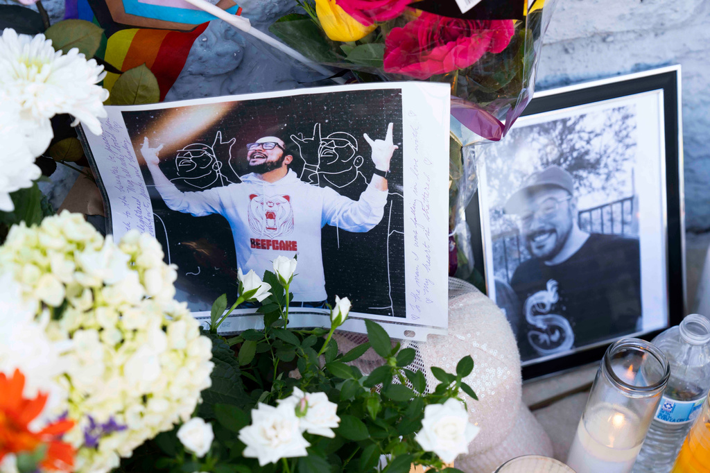 A growing memorial sits outside the Venture-N Bar in Tucson, Ariz., Tuesday, Sept. 1, 2026, for Vincent Siquieros, pictured, and Cameron Capara, who were fatally shot in the parking lot of the gay bar shortly after midnight Monday. (AP Photo/Rebecca Noble)
