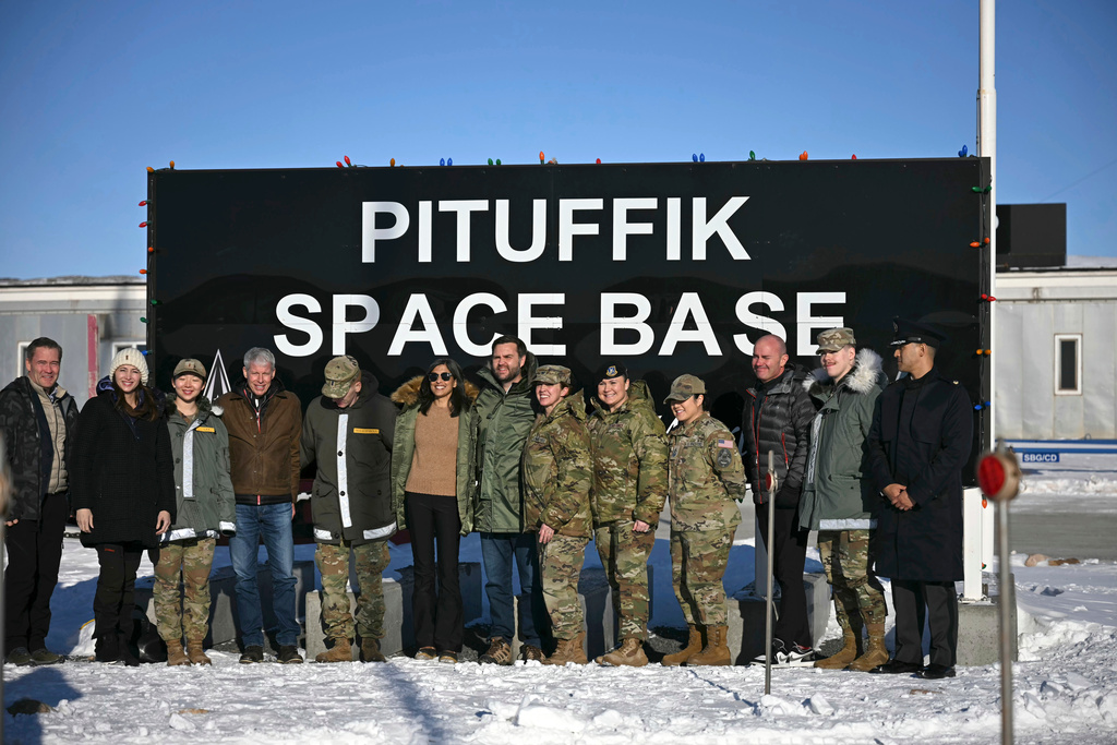 FILE - Vice President JD Vance, center right, and second lady Usha Vance, center left, pose with personnel at Pituffik Space Base, Friday, March 28, 2025, in Greenland. (Jim Watson/Pool via AP, File)
