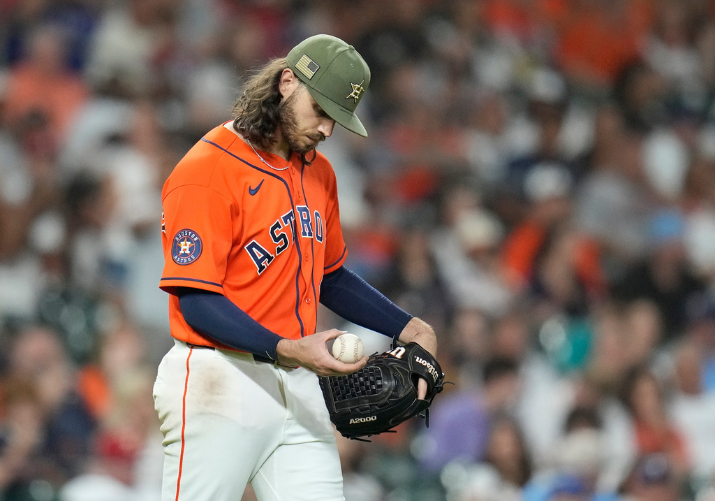 Houston Astros starting pitcher Spencer Arrighetti reacts after a single hit by Texas Rangers' Justin Foscue broke up his no-hit bid during the eighth inning of a baseball game, Friday, May 15, 2026, in Houston. (AP Photo/Karen Warren)