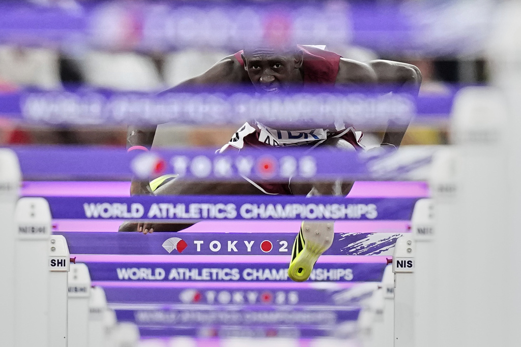 Qatar's Oumar Doudai Abakar competes in a men's 110 meters hurdles heat at the World Athletics Championships in Tokyo, Monday, Sept. 15, 2025. (AP Photo/Petr David Josek)