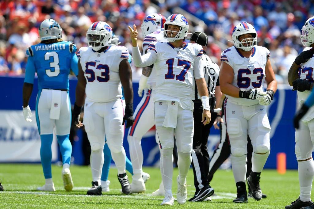 Buffalo Bills quarterback Josh Allen (17) signals for a first down after a penalty during the first half of a preseason NFL football game against the Carolina Panthers, Saturday, Aug. 15, 2026, in Orchard Park, N.Y. (AP Photo/Adrian Kraus)