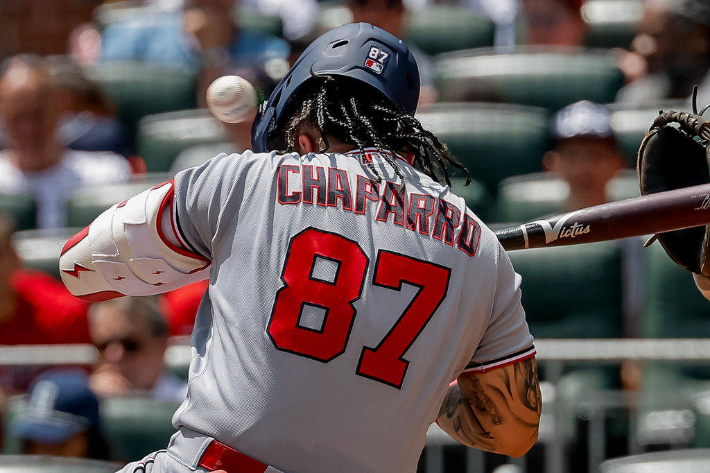 Washington Nationals' Andrés Chaparro is hit on the helmet by a pitch from Atlanta Braves' JR Ritchie during the fourth inning of a baseball game, Sunday, Aug. 2, 2026, in Atlanta. (AP Photo/Erik S. Lesser)