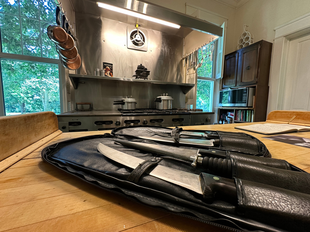 A set of cutlery owned by KFC founder Harland Sanders and a large commercial stove that are up for auction are seen in Shelbyville, Ky., on Wednesday, July 22, 2026. (AP Photo/Dylan Lovan)