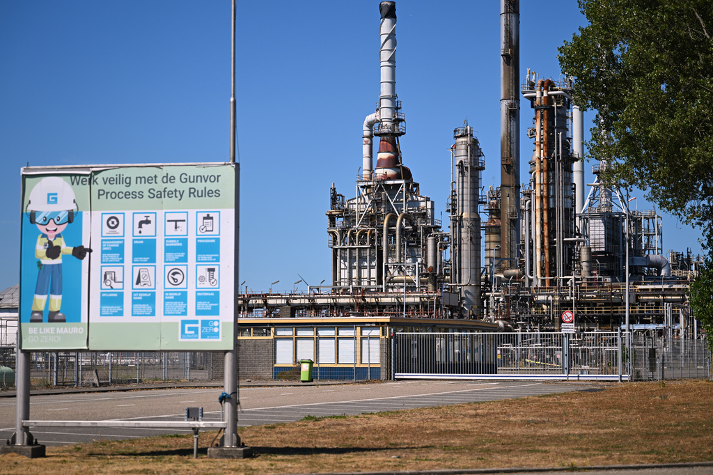 A works safety banner is placed outside a refinery and fuel terminal run by Gunvor Energy where an explosion occurred at the Dutch port of Rotterdam which killed at least one person and injured several others according to police, in Rotterdam, Netherlands, Thursday, Aug. 13, 2026. (AP Photo/Mouneb Taim)
