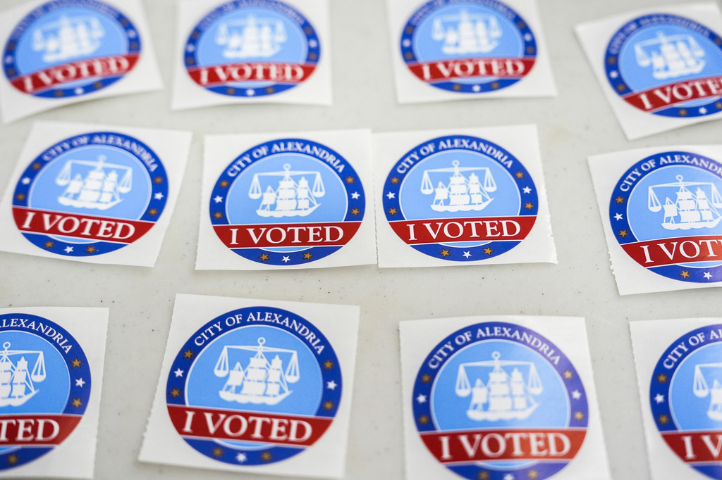 "I Voted" stickers are laid out on a table at Lyles-Crouch Traditional Academy on election day for the Virginia redistricting referendum, Tuesday, April 21, 2026, in Alexandria, Va. (AP Photo/Julia Demaree Nikhinson)