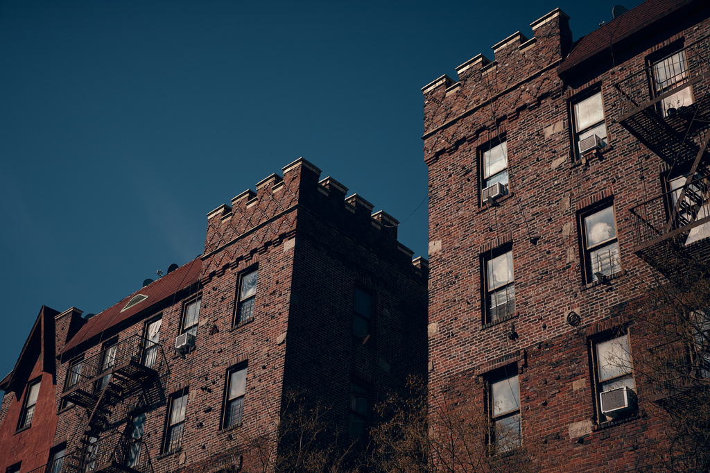 Sunlight illuminates an apartment building where tenants report maintenance issues and pest infestations, in the Bronx borough of New York, on Tuesday, March 17, 2026. (AP Photo/Andres Kudacki)