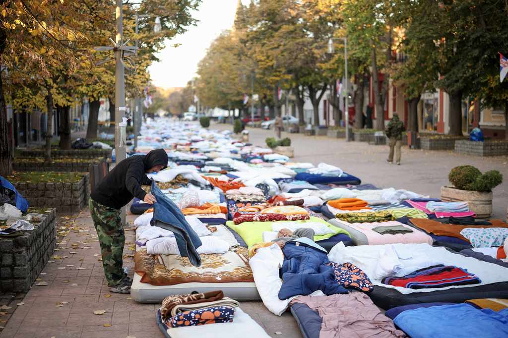 Students and anti-government protesters prepare to continue marching to Novi Sad for a huge rally on Nov. 1 marking the first anniversary of a train station disaster that killed 16 people, in Indjija, Serbia, Friday, Oct. 31, 2025. (AP Photo/Armin Durgut)