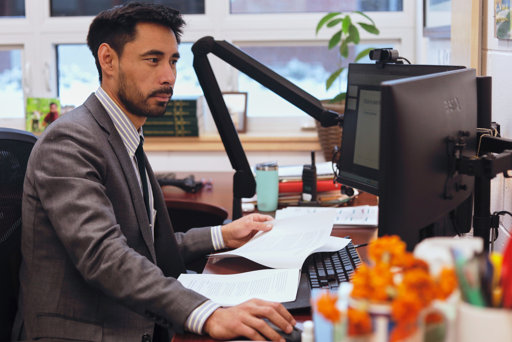 Winooski School District Superintendent Wilmer Chavarria works at his desk, Wednesday, Dec. 10, 2025, in Winooski, Vt. (AP Photo/Amanda Swinhart)