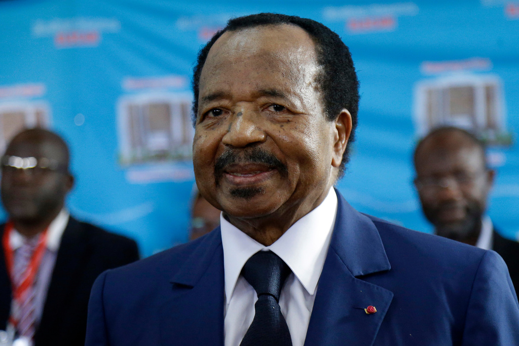 FILE - Cameroon's President Paul Biya, of the Cameroon People's Democratic Movement party, waits to cast his vote during the presidential elections, Oct. 7, 2018, in Yaounde, Cameroon. (AP Photo/Sunday Alamba, File)