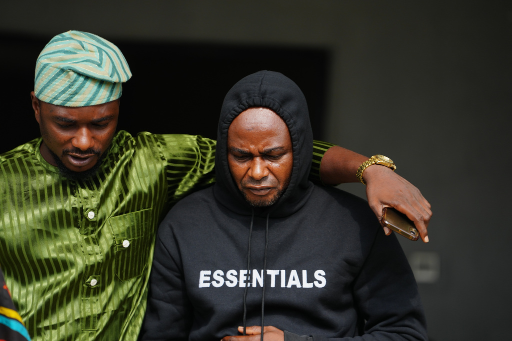 CORRECTS INFO TO FORMER HEAVYWEIGHT CHAMPION Adeniyi Mobolaji Kayode, 46, right, the driver in a car crash that injured former heavyweight champion Anthony Joshua and killed his two friends in Nigeria, leaves after a hearing at the magistrates court, in Sagamu, south west Nigeria, Tuesday, Jan. 20, 2026. (AP Photo/Sunday Alamba)