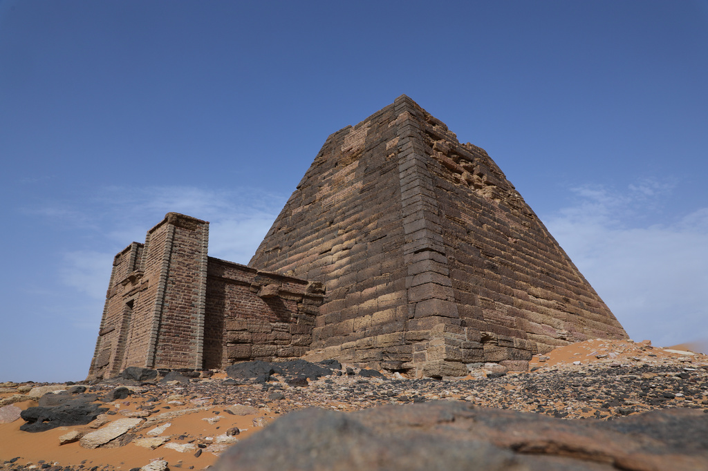 A pyramid stands at the Meroe archaeological site in Bejrawiya, Sudan, Saturday, Aug. 1, 2026. (AP Photo/Mohnd Blal)