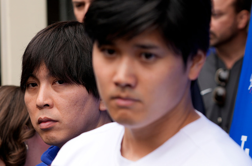 FILE - Ippei Mizuhara, left, stands next to Los Angeles Dodgers player Shohei Ohtani, right, during an interview at Dodger Stadium, Feb. 3, 2024. (AP Photo/Richard Vogel, File) FILE - Ippei Mizuhara, left, stands next to Los Angeles Dodgers player Shohei Ohtani, right, during an interview at Dodger Stadium, Feb. 3, 2024. (AP Photo/Richard Vogel, File)