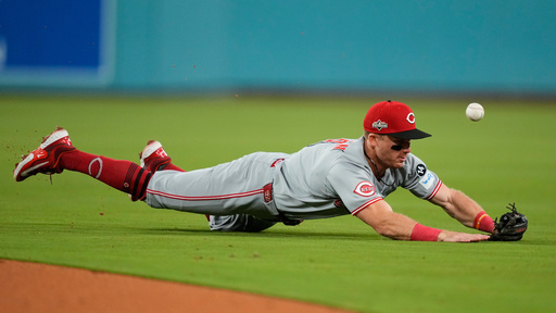 Cincinnati Reds second baseman Matt McLain cannot make a diving stop on a single from Los Angeles Dodgers' Max Muncy during the fourth inning in Game 2 of the National League Wild Card baseball playoff series Wednesday, Oct. 1, 2025, in Los Angeles. (AP Photo/Mark J. Terrill) Cincinnati Reds second baseman Matt McLain cannot make a diving stop on a single from Los Angeles Dodgers' Max Muncy during the fourth inning in Game 2 of the National League Wild Card baseball playoff series Wednesday, Oct. 1, 2025, in Los Angeles. (AP Photo/Mark J. Terrill)