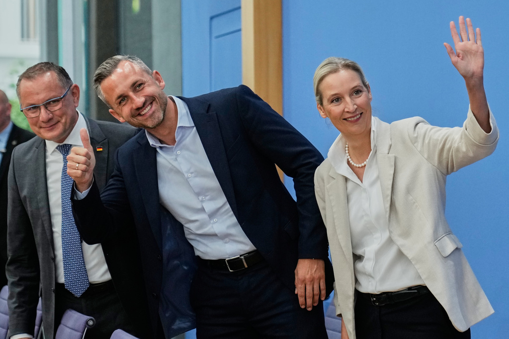Co-leaders of Alternative for Germany party, or AfD, Alice Weidel, right, and Tino Chrupalla, left, and top candidate for the Saxony-Anhalt state elections Ulrich Siegmund, center, attend a press conference in Berlin, Germany, Monday, Sept. 7, 2026. (AP Photo/Ebrahim Noroozi)
