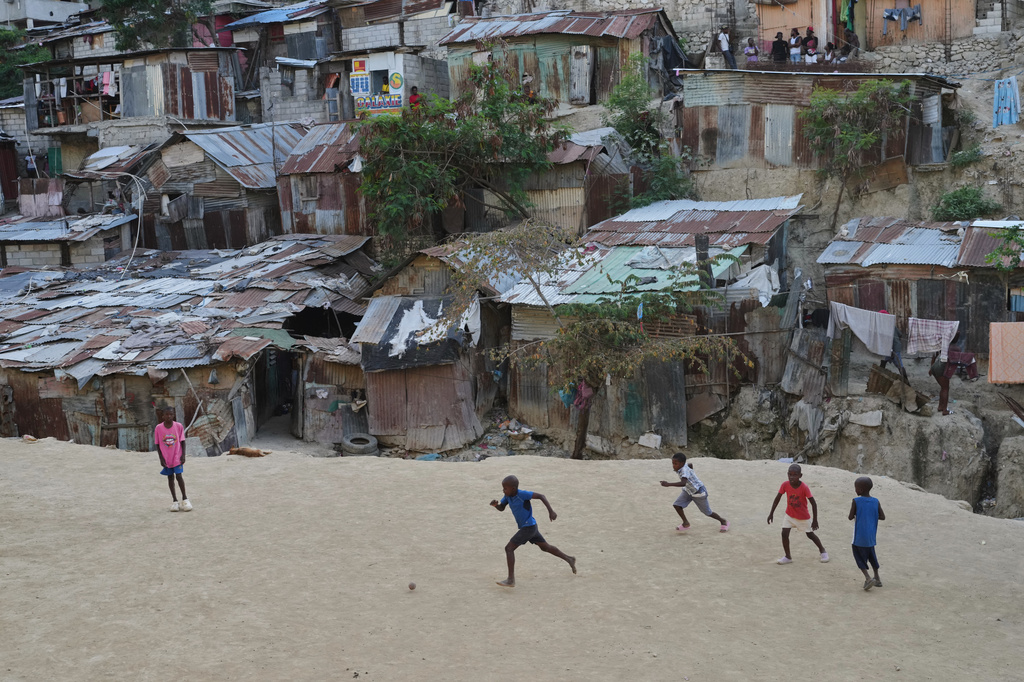 Children play soccer with a plastic ball in the Pétion-Ville neighborhood of Port-au-Prince, Haiti, Wednesday, May 27, 2026. (AP Photo/Odelyn Joseph)