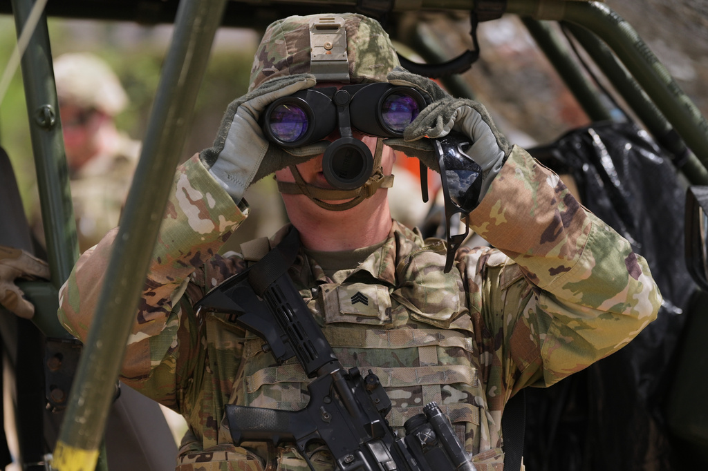 U.S. Army personnel keep watch over the U.S.-Mexico border in Roma, Texas, Thursday, Oct. 8, 2026. (AP Photo/Eric Gay)