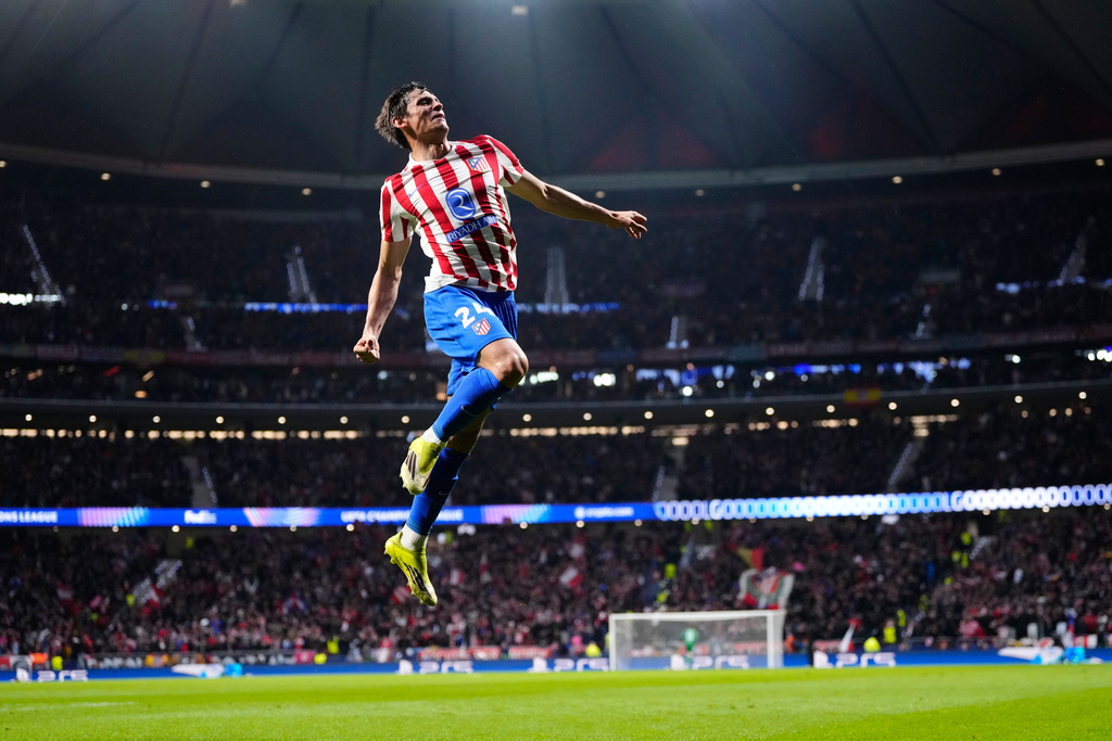 Atletico Madrid's Robin Le Normand celebrates after scoring his side's fourth goal during the first leg of the Champions League round of 16 soccer match between Atletico Madrid and Tottenham in Madrid, Spain, Tuesday, March 10, 2026. (AP Photo/Jose Breton)