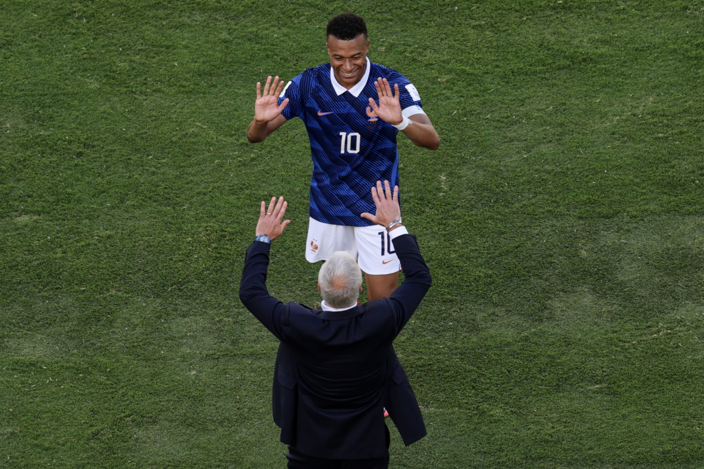 France head coach Didier Deschamps and Kylian Mbappe celebrate after the third goal during the World Cup Group I soccer match between France and Senegal in East Rutherford, N.J., near New York, Tuesday, June 16, 2026. (AP Photo/Adam Hunger)