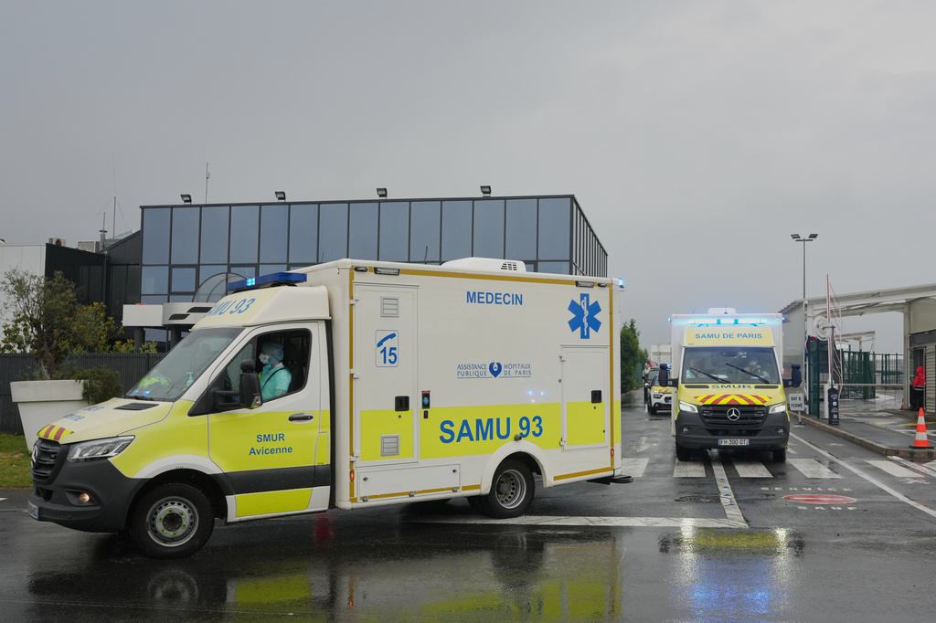 Ambulances carrying patients evacuated from the MV Hondius cruise ship with suspected hantavirus infection, leave the Bourget airport, north of Paris, Sunday, May 10, 2026. (AP Photo/Thibault Camus)