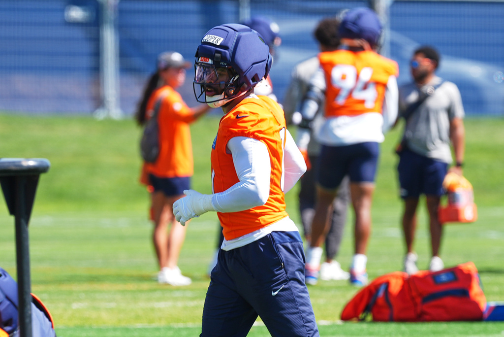 Denver Broncos linebacker Jonathon Cooper takes part in drills during a practice at the team's NFL football training camp, Wednesday, July 29, 2026, in Centennial, Colo. (AP Photo/David Zalubowski)