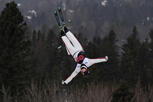 FILE - Marion Thenault, of Sherbrooke, Canada, jumps to a third place finish at the FIS freestyle world cup women's aerials in Lac-Beauport, Canada on Feb. 10, 2024. (Karoline Boucher/The Canadian Press via AP, File) FILE - Marion Thenault, of Sherbrooke, Canada, jumps to a third place finish at the FIS freestyle world cup women's aerials in Lac-Beauport, Canada on Feb. 10, 2024. (Karoline Boucher/The Canadian Press via AP, File)