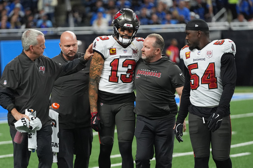 Tampa Bay Buccaneers wide receiver Mike Evans (13) is helped off the field after an injury during the first half of an NFL football game against the Detroit Lions, Monday, Oct. 20, 2025, in Detroit. AP Photo/Paul Sancya) Tampa Bay Buccaneers wide receiver Mike Evans (13) is helped off the field after an injury during the first half of an NFL football game against the Detroit Lions, Monday, Oct. 20, 2025, in Detroit. AP Photo/Paul Sancya)