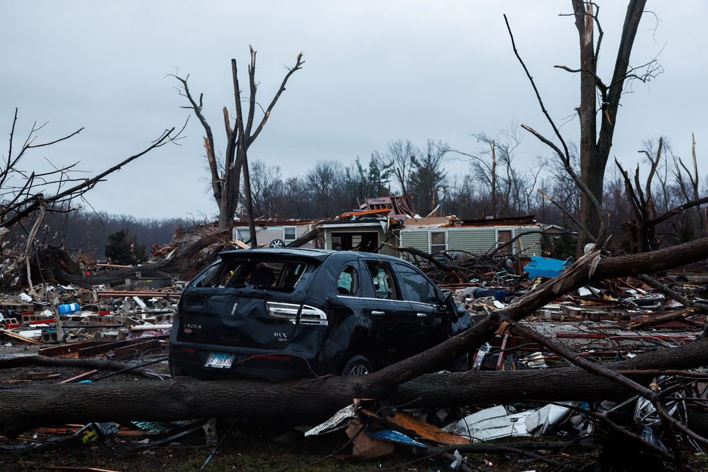Homes sit destroyed after a tornado and thunder storms passed through the area overnight on Wednesday March 11, 2026 in Aroma Park, Ill. (Armando L. Sanchez/Chicago Tribune via AP)