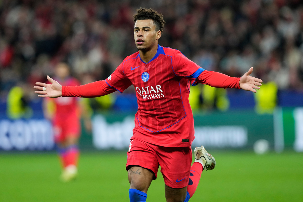 PSG's Desire Doue celebrates after scoring his side's second goal during a Champions League opening phase soccer match between Bayer Leverkusen and Paris Saint-Germain in Leverkusen, Germany, Tuesday, Oct. 21, 2025. (AP Photo/Martin Meissner)