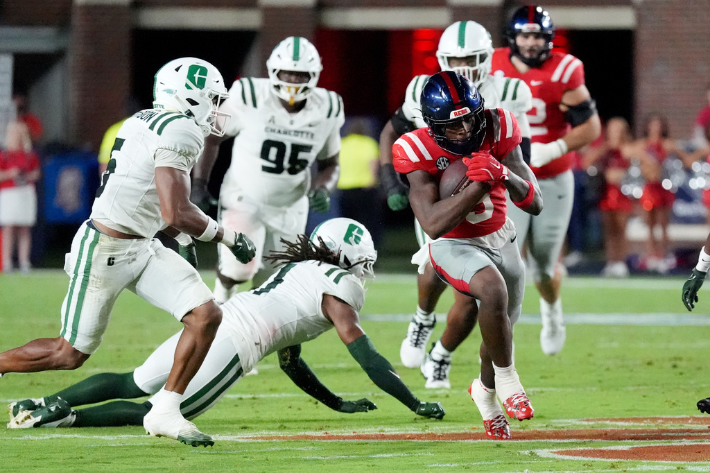 Mississippi running back Kewan Lacy (5) sprints past Charlotte defensive players during the first half of an NCAA college football game in Oxford, Miss., Saturday, Sept. 12, 2026. (AP Photo/Rogelio V. Solis)
