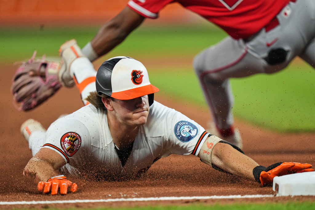 Baltimore Orioles' Coby Mayo slides into third base after hitting a triple during the seventh inning of a baseball game against the Los Angeles Angels, Tuesday, Aug. 4, 2026, in Baltimore. (AP Photo/Stephanie Scarbrough)