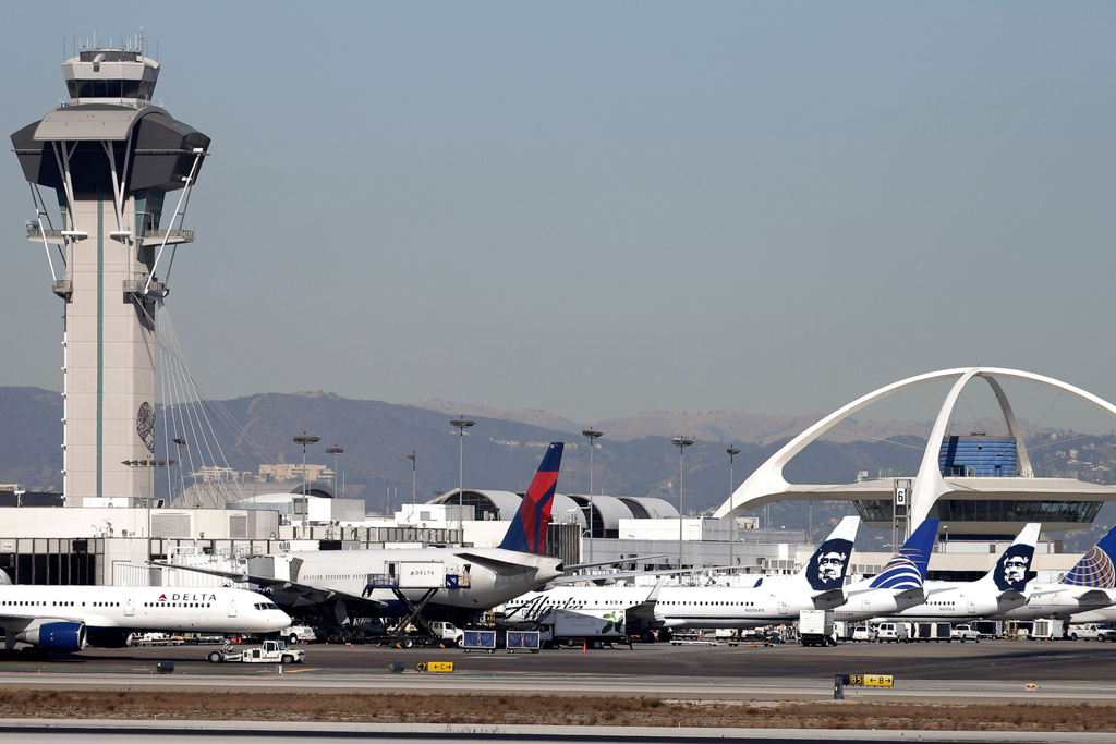 FILE - Airplanes sit on the tarmac at Los Angeles International Airport Nov. 1, 2013. (AP Photo/Gregory Bull, File)