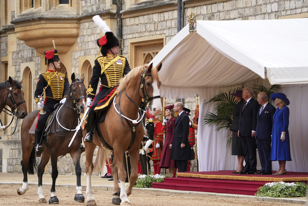 From left, Britain's Kate, Princess of Wales, Britain's Prince William, President Donald Trump and first lady Melania Trump, Britain's King Charles III and Britain's Queen Camilla during the national anthems at an arrival ceremony at Windsor Castle, in Windsor, England, Wednesday, Sept. 17, 2025. (AP Photo/Evan Vucci)