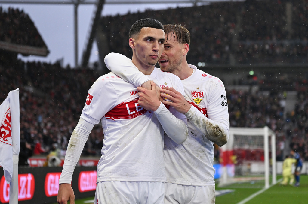 Stuttgart's Bilal El Khannouss, left, celebrates with Maximilian Mittelstädt after scoring his side's fourth goal during the German Bundesliga soccer match between VfB Stuttgart and Hamburger SV, in Stuttgart, Germany, Sunday, April 12, 2026. (Marijan Murat/dpa via AP)