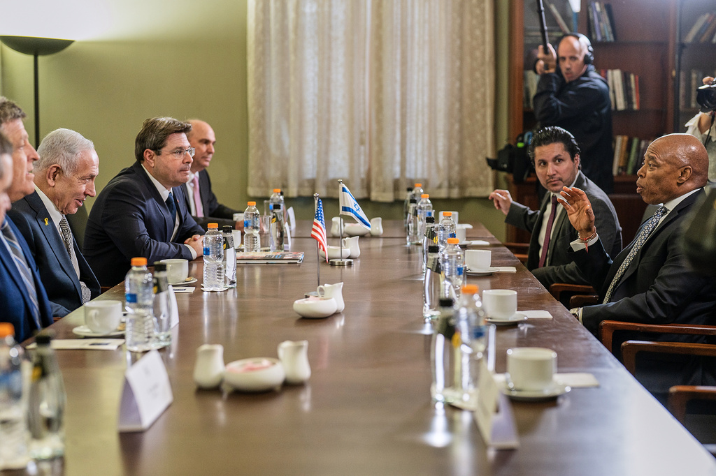 This image released by the Mayoral Photography Office shows New York Mayor Eric Adams, right, as he meets with the Israel Prime Minister Benjamin Netanyahu, second left, in Israel, Nov. 17, 2025. (Benny Polatseck/Mayoral Photography Office via AP)