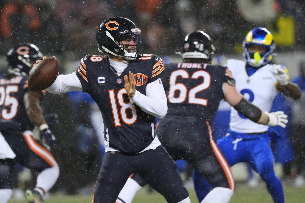 Chicago Bears quarterback Caleb Williams throws a pass against the Los Angeles Rams during the first half of an NFL football divisional playoff game Sunday, Jan. 18, 2026, in Chicago. (AP Photo/Nam Y. Huh)