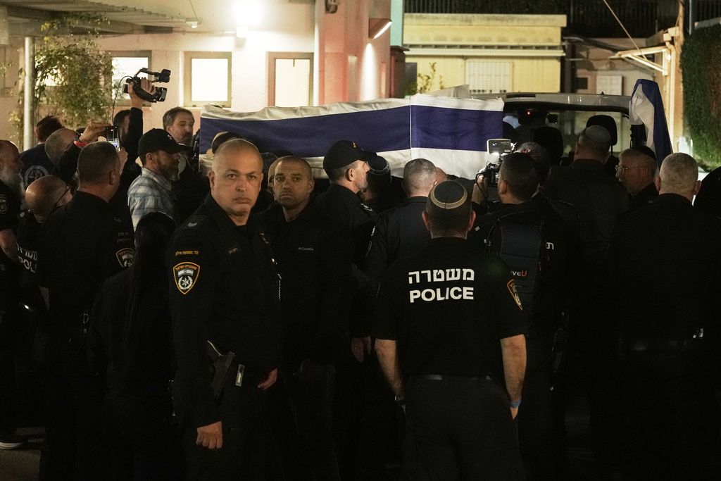 The coffin with remains of Israeli hostage Ran Gvili, last to be recovered from Gaza, arrives to the Abu Kabir Forensic Institute in Tel Aviv, Israel, Monday, Jan. 26, 2026. (AP Photo/Mahmoud Illean)