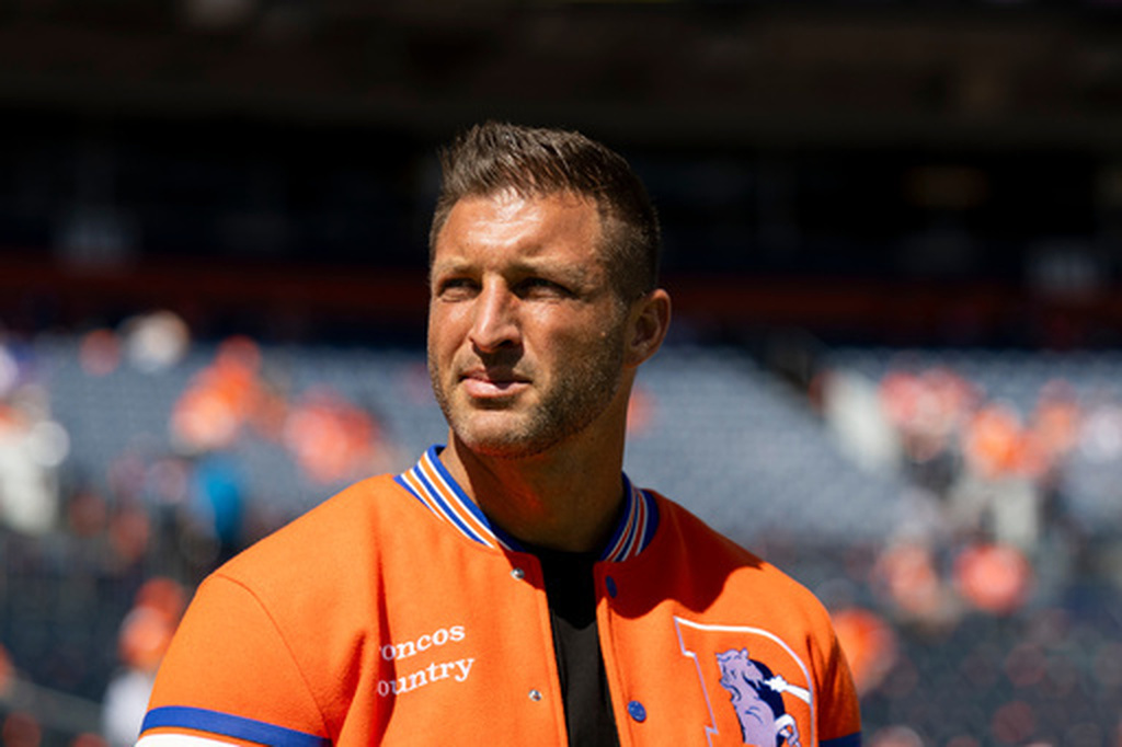 Tim Tebow looks on prior to an NFL football game against the Jacksonville Jaguars, Sunday, Sept. 20, 2026 in Denver. (Gabriel Christus/Denver Broncos via AP)
