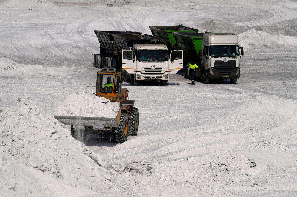 A front-end loader transports phosphogypsum in Phalaborwa, South Africa, Monday, Sept. 8, 2025. (AP Photo/Themba Hadebe)