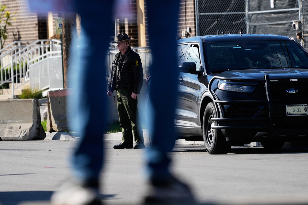 A Illinois State Police officer stands outside an ICE (U.S. Immigration and Customs Enforcement) processing facility in the Chicago suburb of Broadview, Ill., Tuesday, Oct. 21, 2025. (AP Photo/Nam Y. Huh)