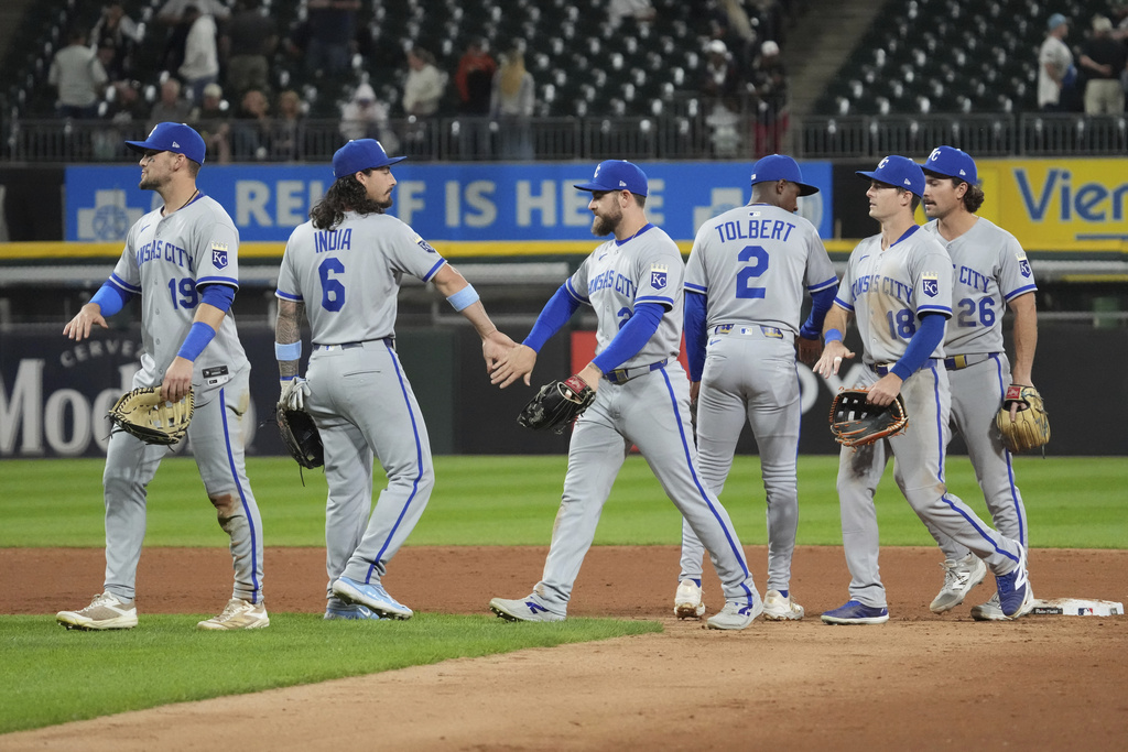 Kansas City Royals players celebrate after the Royals defeated the Chicago White Sox in a baseball game in Chicago, Wednesday, Aug. 27, 2025. (AP Photo/Nam Y. Huh)