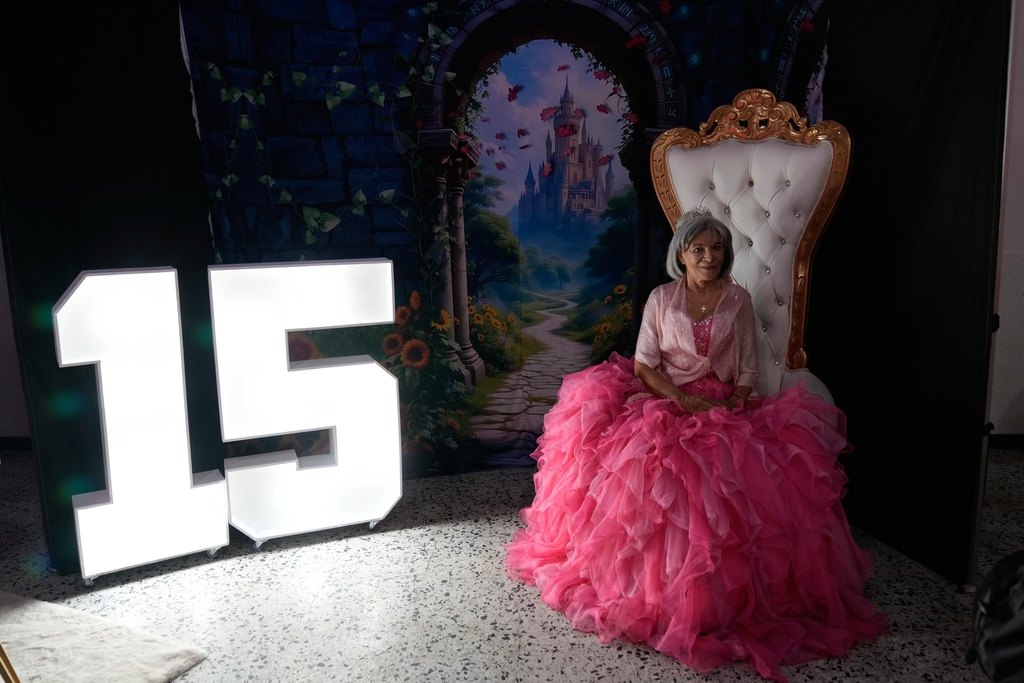Carmen Mora, 71, poses for a photo during a quinceanera celebration for women who never had a 15th birthday party, organized by the Suenos Hechos foundation in Bogota, Colombia, Friday, Oct. 24, 2025. (AP Photo/Fernando Vergara)