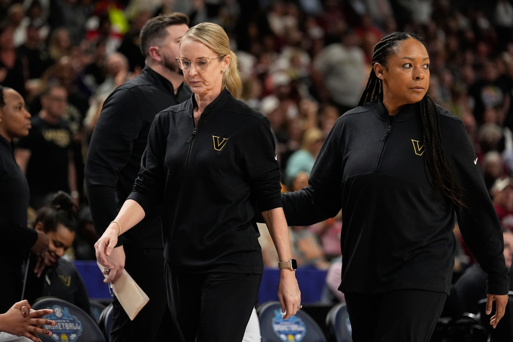 Vanderbilt head coach Shea Ralph leaves the game after being ejected during second half of an NCAA college basketball game against Mississippi in the quarterfinals of the Southeastern Conference tournament, Friday, March 6, 2026, in Greenville, S.C. (AP Photo/Chris Carlson)