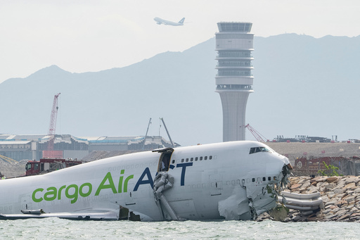 The cargo aircraft that skidded off a Hong Kong airport runway is seen on Monday, Oct. 20, 2025. (AP Photo/Chan Long Hei) The cargo aircraft that skidded off a Hong Kong airport runway is seen on Monday, Oct. 20, 2025. (AP Photo/Chan Long Hei)