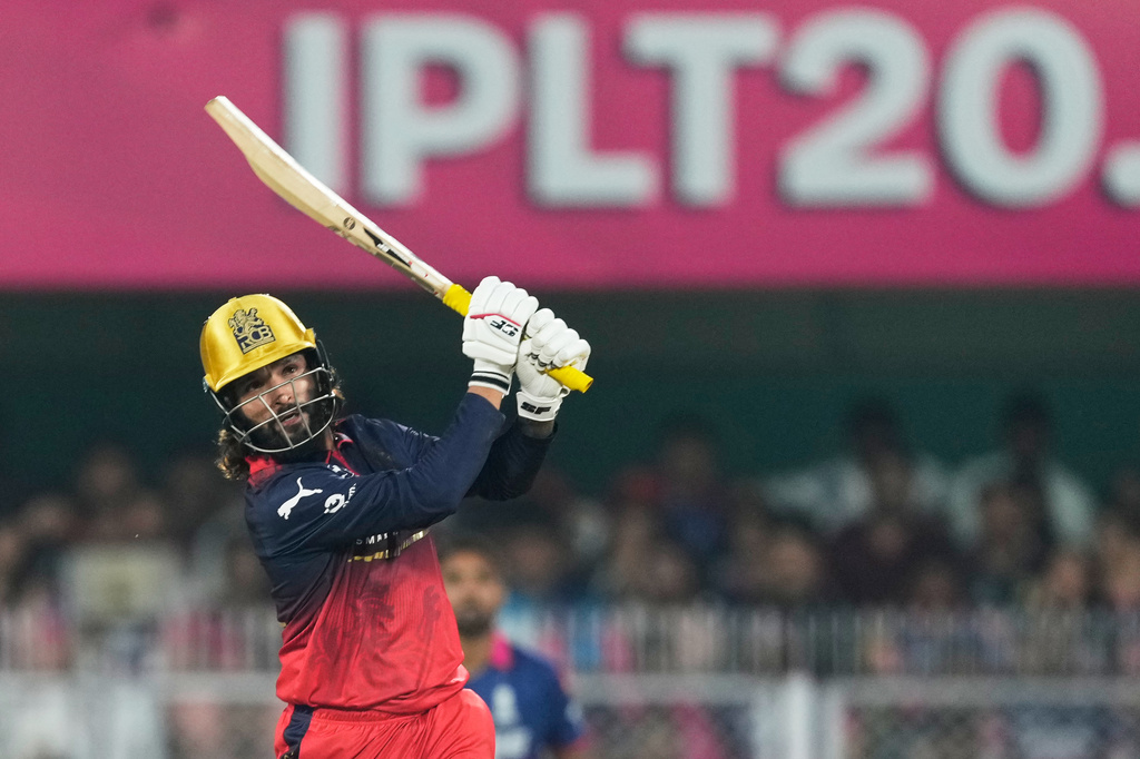 Royal Challengers Bengaluru's captain Rajat Patidar hits a six during the Indian Premier League cricket match between Royal Challengers Bengaluru and Rajasthan Royals in Guwahati, India, Friday, April 10, 2026. (AP Photo/Anupam Nath)