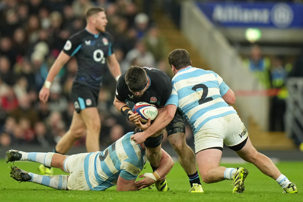 England's Tom Curry drops the ball in a tackle during the Nation's Series rugby union international between England and Argentina at Twickenham, London, Sunday, Nov. 23, 2025. (AP Photo/Alastair Grant)
