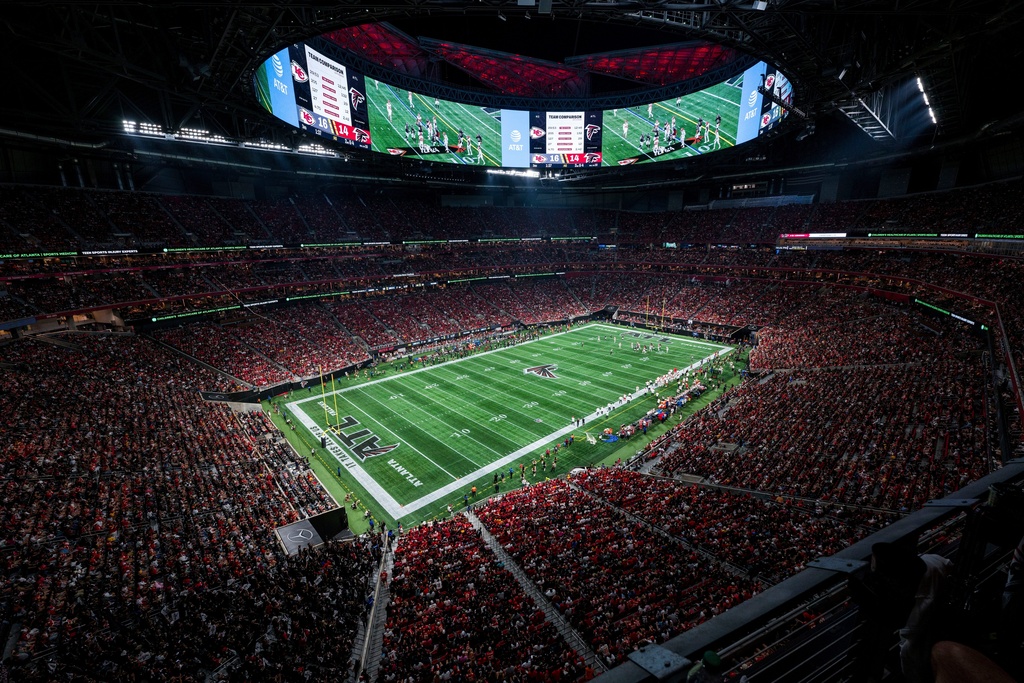 FILE - Fans watch action at the Mercedes-Benz Stadium during an NFL football game between the Atlanta Falcons and the Kansas City Chiefs, Sept. 22, 2024, in Atlanta. (AP Photo/Danny Karnik, File)