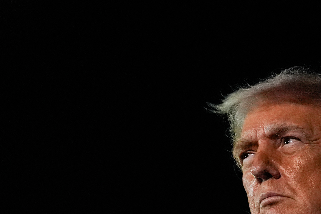 President Donald Trump speaks with reporters after arriving at Palm Beach International Airport, Monday, Jan. 19, 2026, in West Palm Beach, Fla. (AP Photo/Julia Demaree Nikhinson)