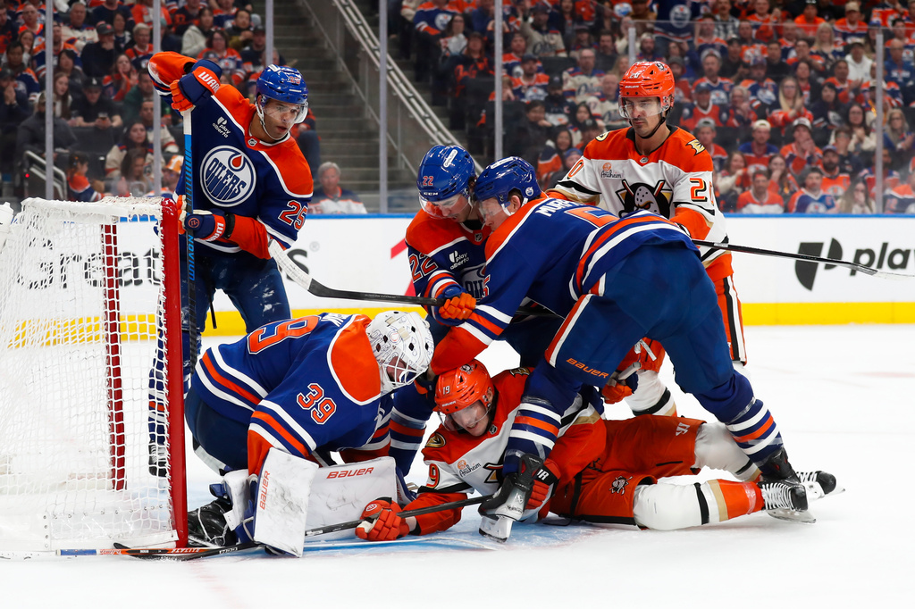 Anaheim Ducks' Troy Terry (19) battles against Edmonton Oilers' goaltender Connor Ingram (39) during the third period of an NHL playoff game in Edmonton on Monday, April 20, 2026. (Codie McLachlan/The Canadian Press via AP)