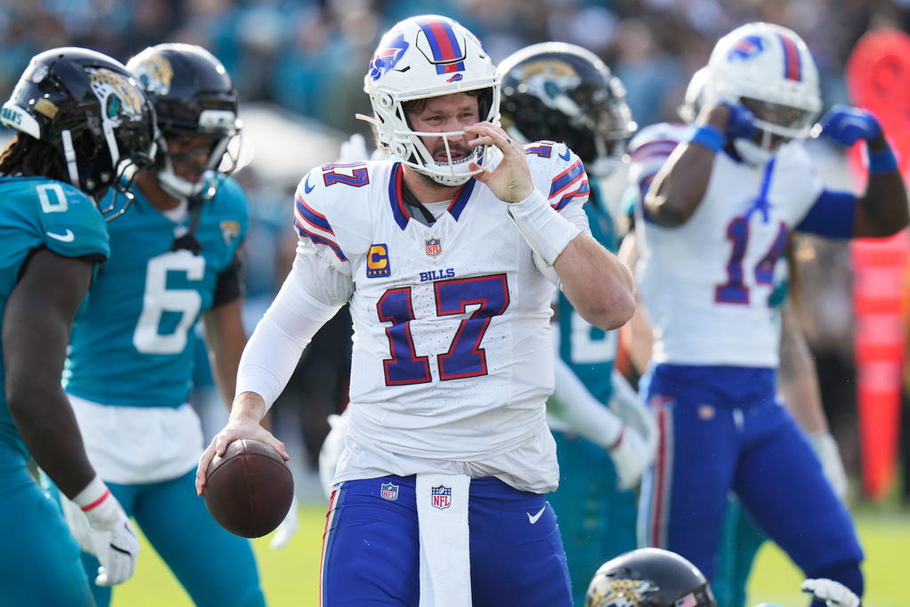 Buffalo Bills quarterback Josh Allen gets up after collecting a first down near the Jacksonville Jaguars end zone later in the second half of an NFL wild-card playoff football game Sunday, Jan. 11, 2026, in Jacksonville, Fla. (AP Photo/Chris O'Meara)