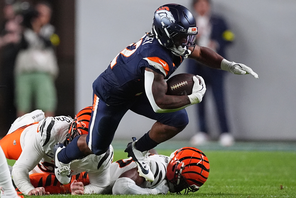 Denver Broncos running back RJ Harvey (12) runs against the Cincinnati Bengals during the second half of an NFL football game Monday, Sept. 29, 2025, in Denver. (AP Photo/David Zalubowski)